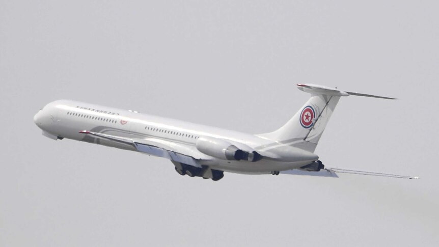 A North Korean plane is seen in the air shortly after take-off from Dalian.