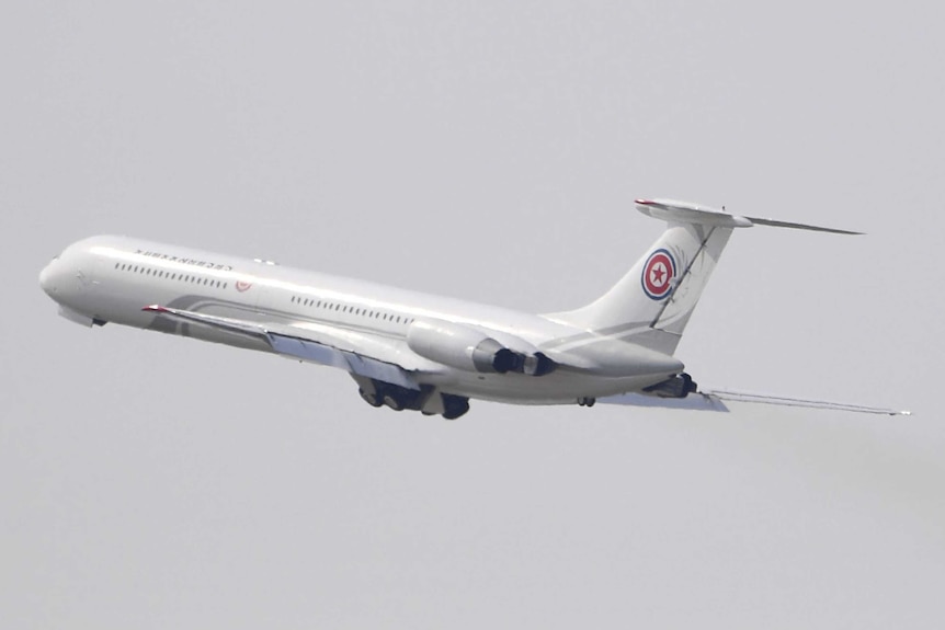 A North Korean plane is seen in the air shortly after take-off from Dalian.