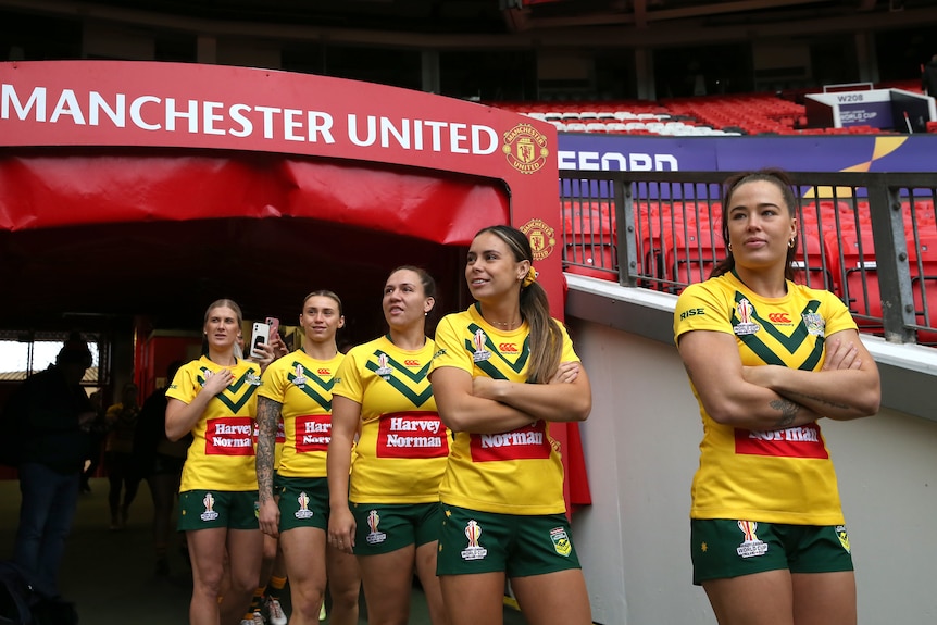 Isabelle Kelly leads Jillaroos teammates out of the tunnel onto Old Trafford.