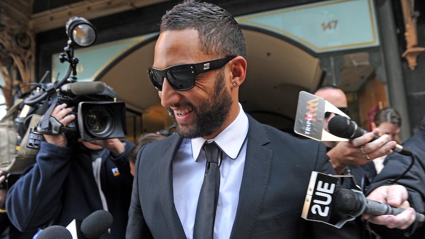 West Tigers NRL star Benji Marshall leaves Downing Centre Court in Sydney on August 23, 2011.