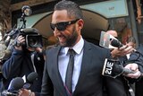 West Tigers NRL star Benji Marshall leaves Downing Centre Court in Sydney on Augst 23, 2011.