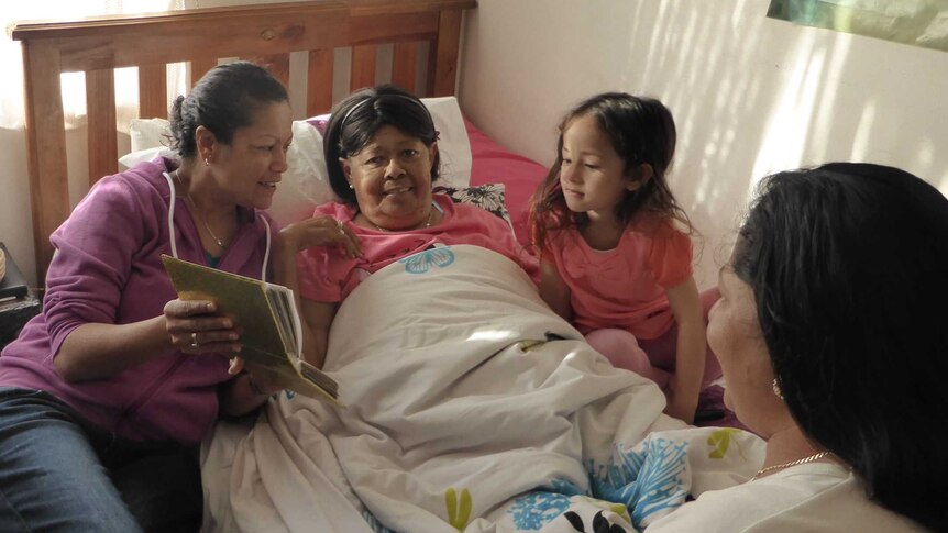 Roseann Tenhunan surrounded by her family at home as part of palliative care services.