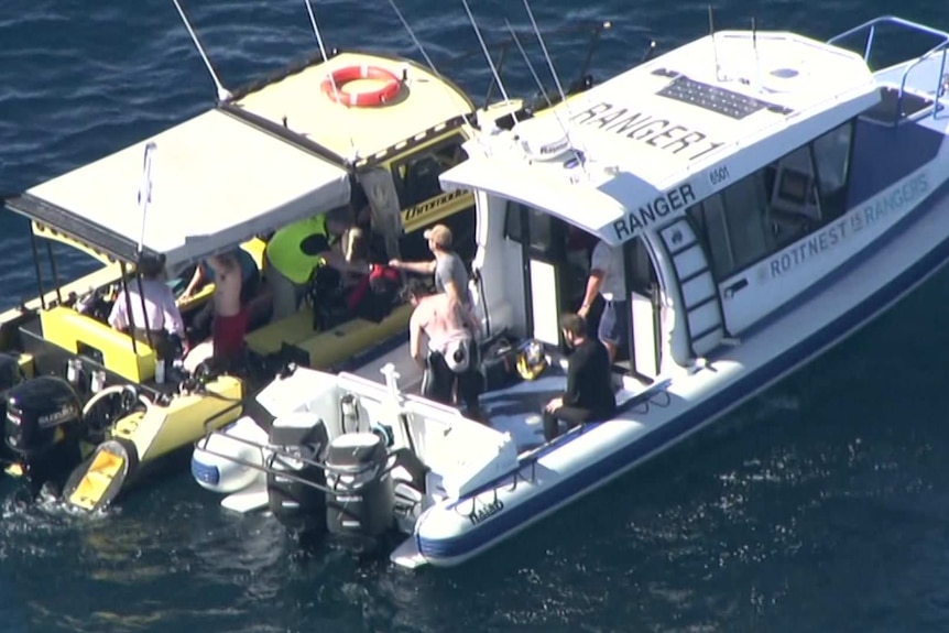 Vision taken from a chopper of men in boats after a diver failed to surface at Rottnest