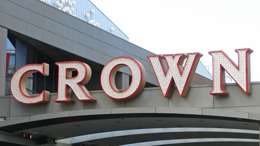 The word 'Crown' is spelled out in large white letters on the side of a building.