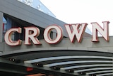 The word 'Crown' is spelled out in large white letters on the side of a building.