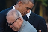 Barack Obama hugs Shigeaki Mori, an elderly survivor of the 1945 atomic bombing of Hiroshima during his visit to the memorial.