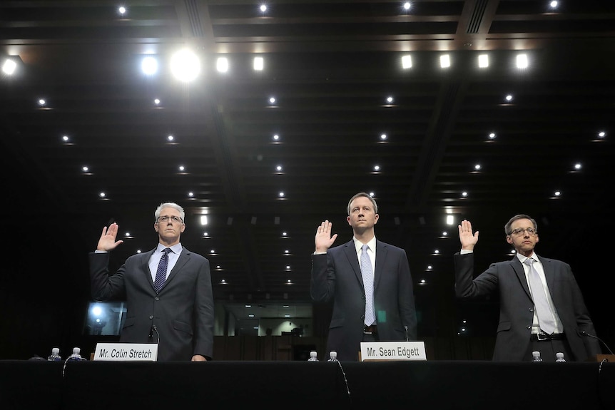 Three men swearing the oath.