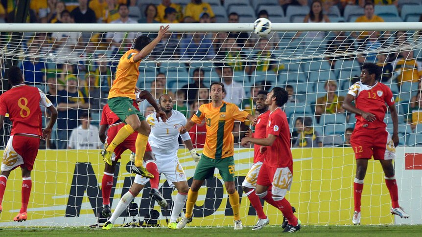 Tim Cahill finds the net against Oman