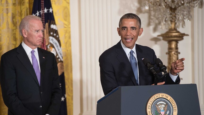 US Vice President Joe Biden looks on as President Barack Obama speaks