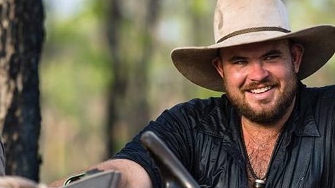 Chris Wilson smiling wearing a cowboy hat.