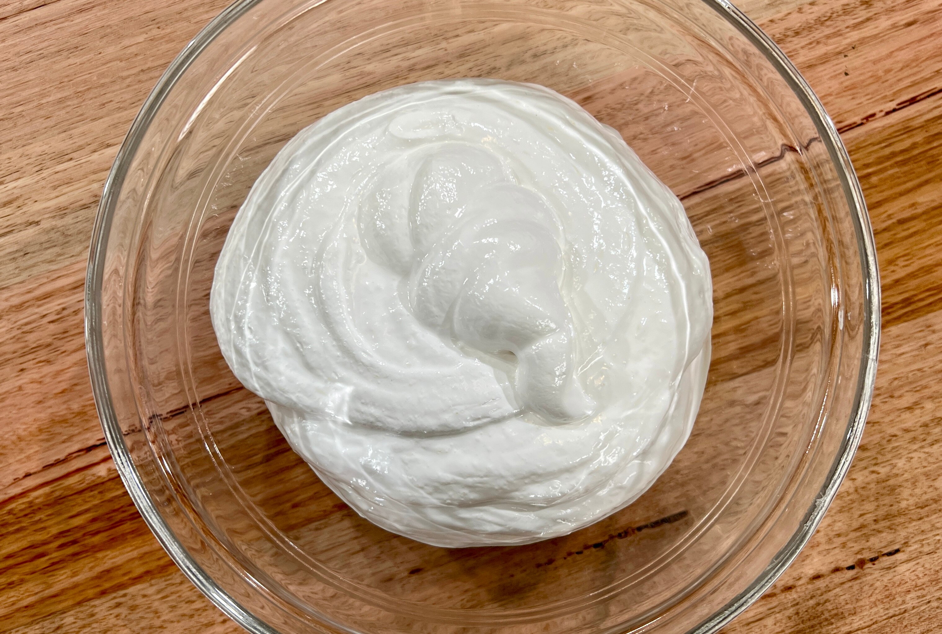 A picture of masrcapone mixture sitting in a glass bowl.