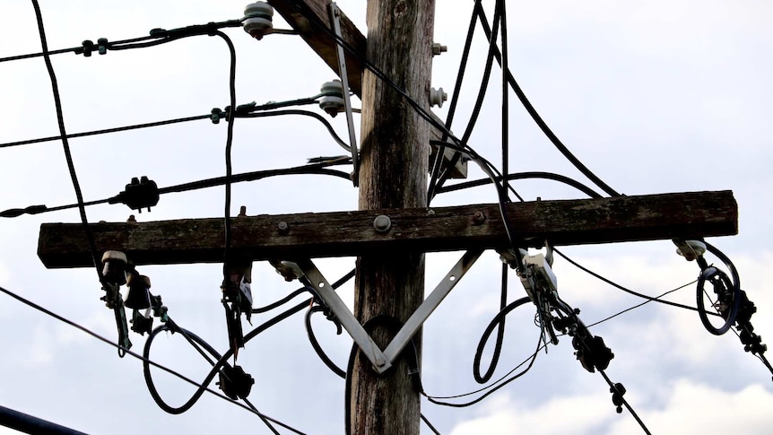 An electricity pole and wires.