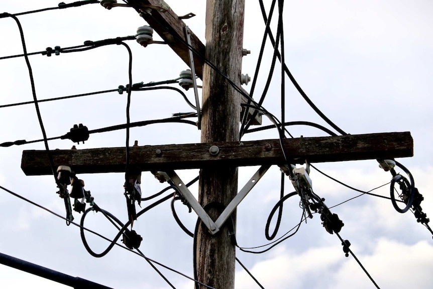 An electricity pole and wires.