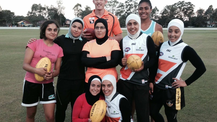 GWS Giants player Sam Frost with the newly named Auburn Giants women's AFL team April 4, 2014.