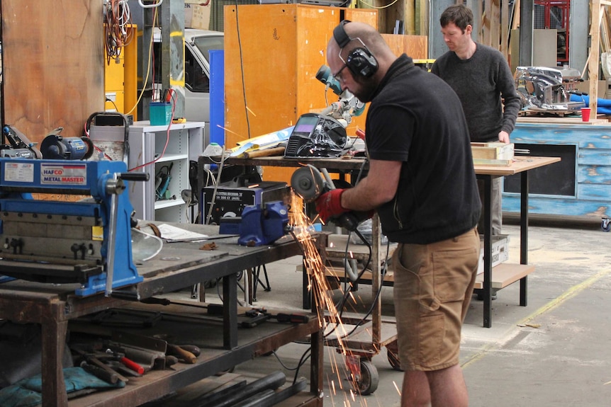 Two men work in a warehouse