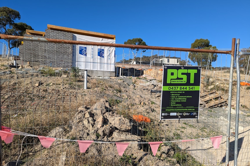 A building site behind a fence