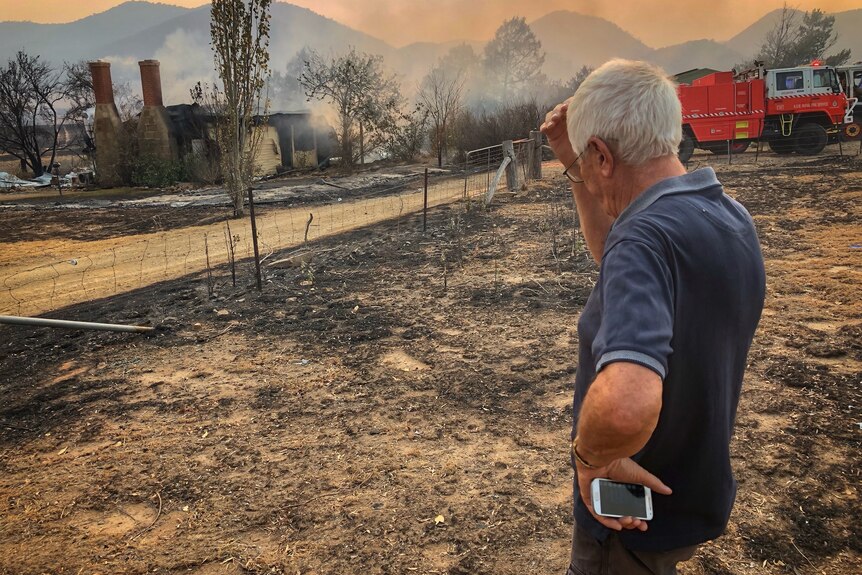 Colinton resident looks over his razed home