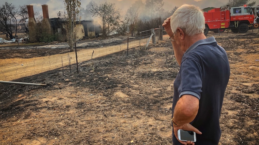 Colinton resident looks over his razed home