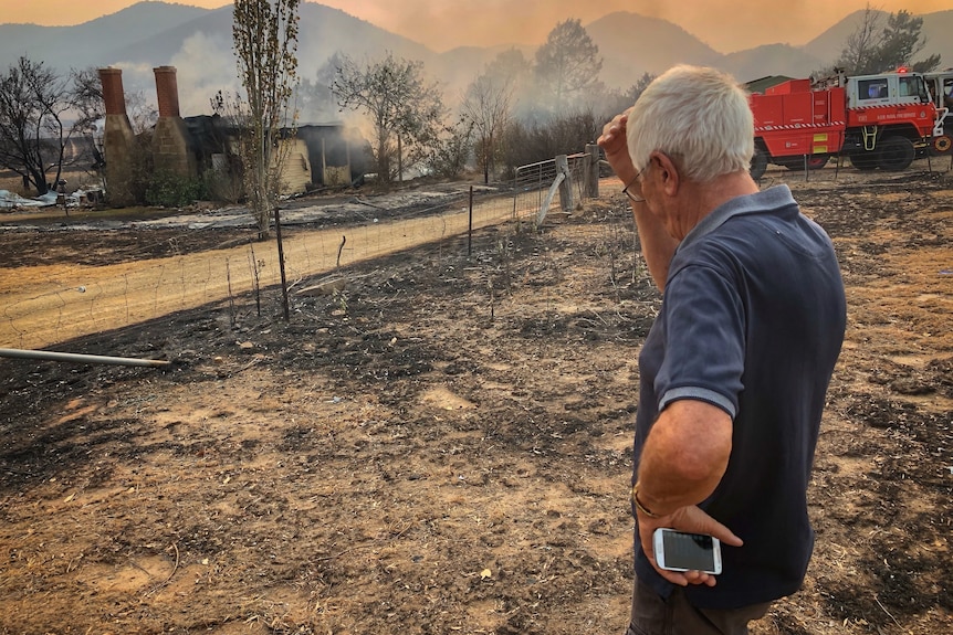 Colinton resident looks over his razed home