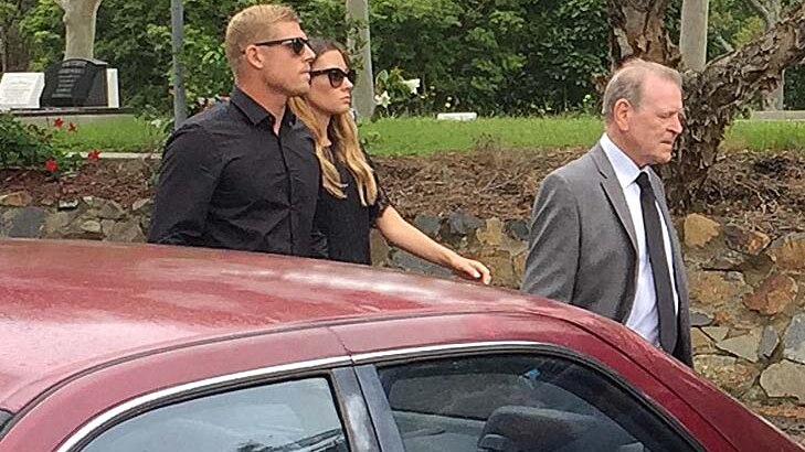 Mick Fanning walking into the funeral of his brother, Peter.