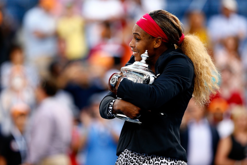 Serena Williams hugs the US Open trophy