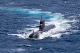 A submarine emerges from water