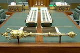 The mace in the House of Representatives at Parliament House sits in its holder in the Chamber.