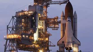 The space shuttle Discovery waits on the launching pad at Cape Canaveral.
