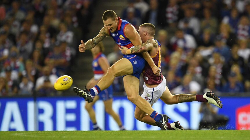 Lions' Claye Beams tackles Bulldogs' Clay Smith