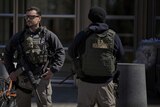 US marshals stand outside US Federal Court in Brooklyn