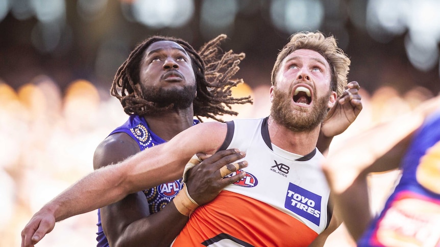 Nic Naitanui and Dawsom Simpson contest the ball in the Eagles versus Giants match.