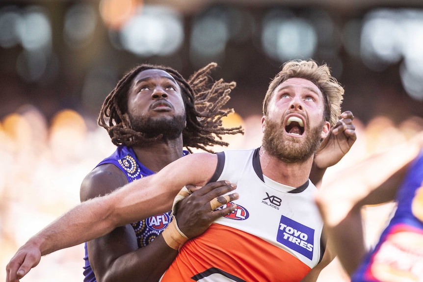 Nic Naitanui and Dawsom Simpson contest the ball in the Eagles versus Giants match.