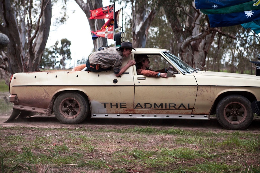 Two blokes hooning in a ute