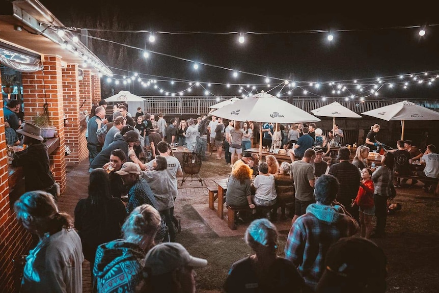 A pub courtyard full of people.