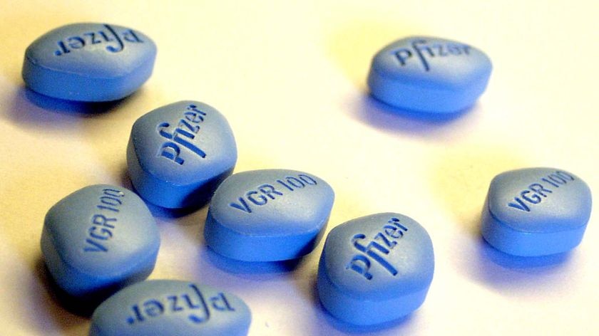 Viagra pills sit on a table