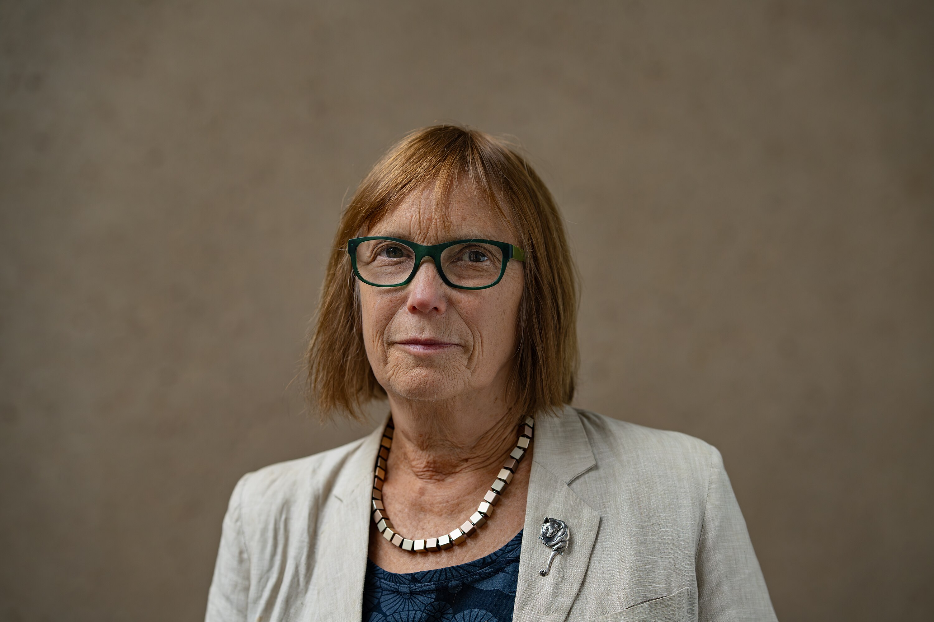 A woman wearing glasses.