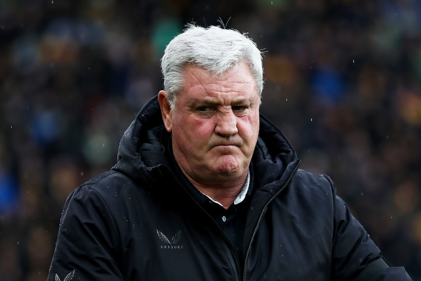 Steve Bruce wrinkles his face up and looks to the side