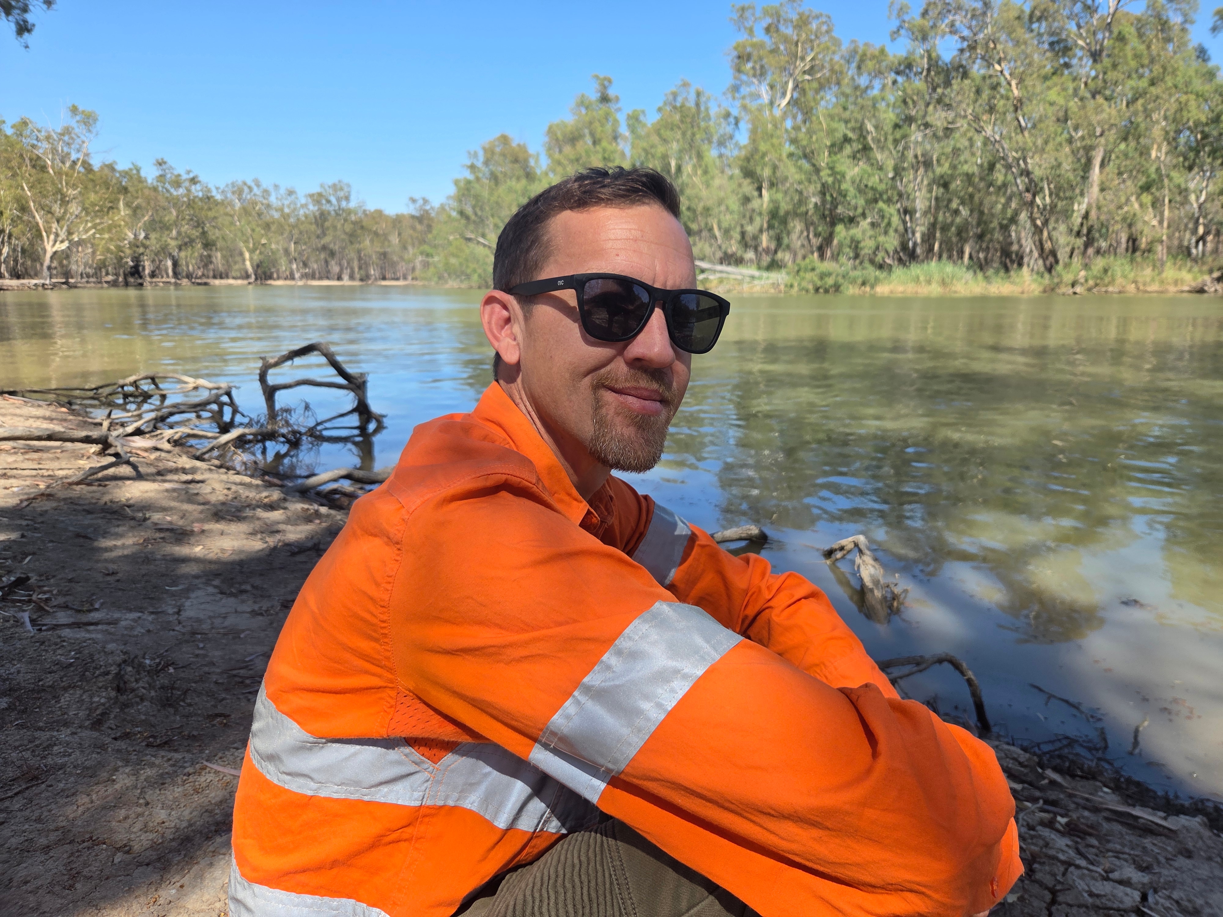 Casey sits by the Murray River