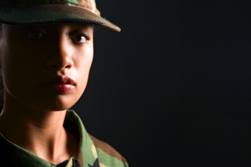 Close-up of a female soldier in camo clothing. (Getty Imgaes: Jupiterimages)