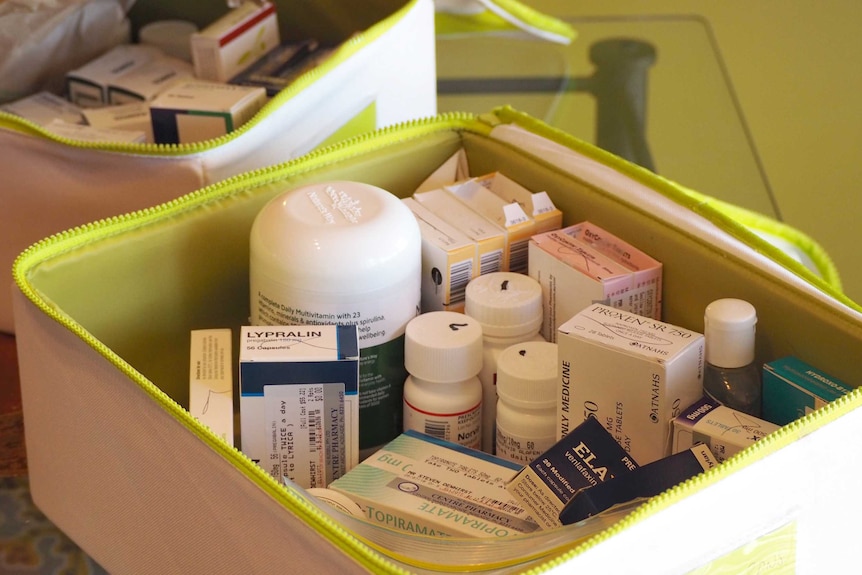 A box containing various medications.