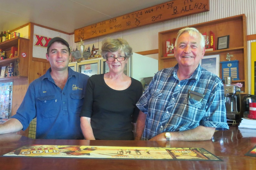 Nicholas, Gerry and Chris Gimblett behind the bar at the Yaraka Hotel, western Queensland