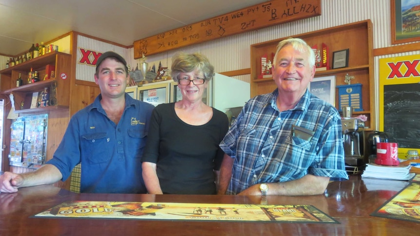 Nicholas, Gerry and Chris Gimblett behind the bar at the Yaraka Hotel, western Queensland
