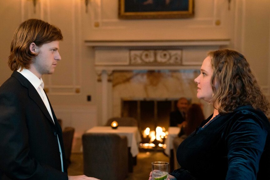 A scene from the film French Exit with Lucas Hedges and Danielle Macdonald talking in a fancy French apartment