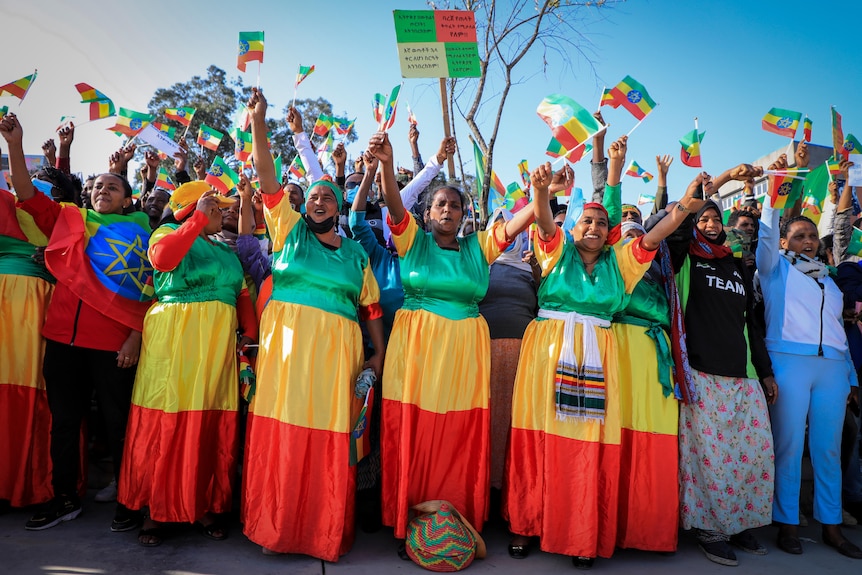 People dressed in the colors of the national flag gather at a rally in Addis Ababa. 