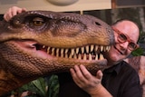 Stephen Goldsworthy with an Australovenator at the WA Museum