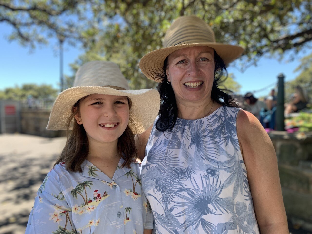 Lisa Adametz and her daughter, Hannah, pictured both wearing sunhats. 