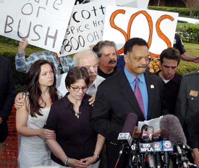 Devastated: Shiavo's parents with Reverend Jesse Jackson [file photo]