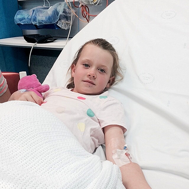 Emma Kiley lies in a hospital bed recovering from a snake bite.