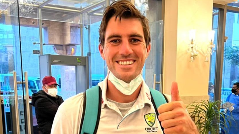 Pat Cummins gives the thumbs up after arriving in Pakistan.