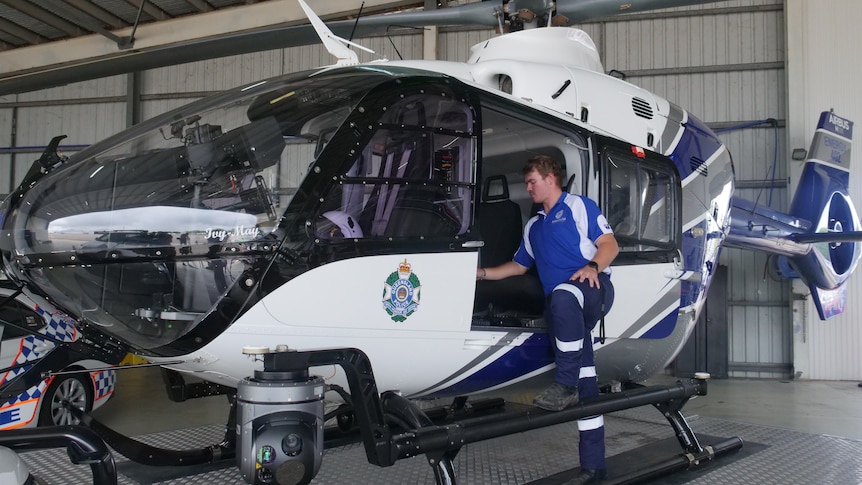 A police helicopter in hangar.